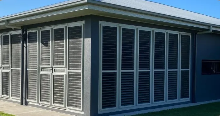 Aluminium shutters enclosing a Townsville alfresco area