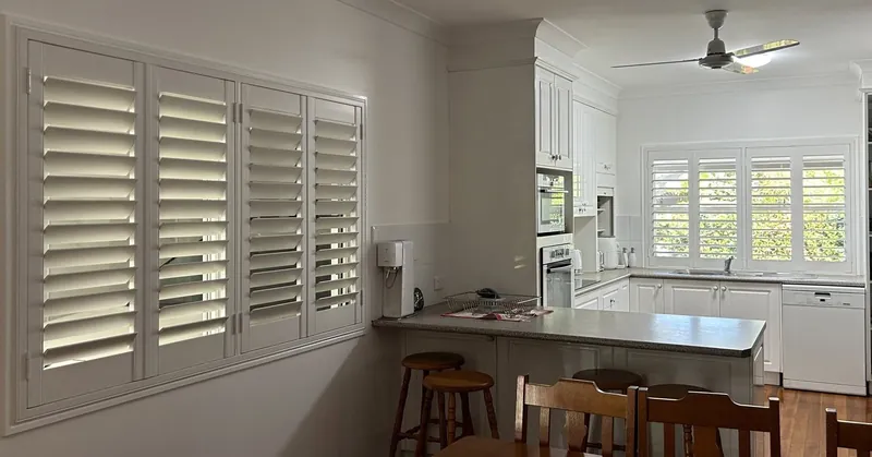 Plantation shutters in a kitchen and dining area