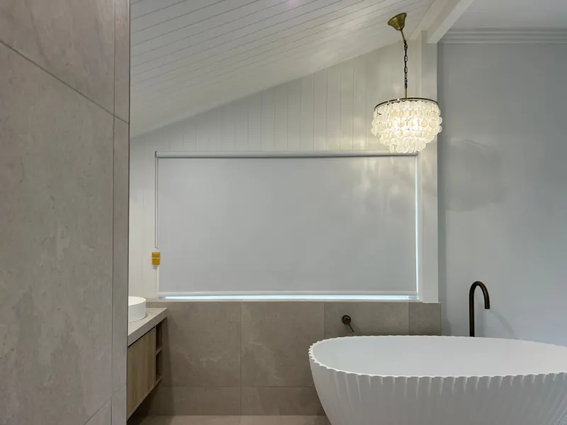 Roller blind giving privacy in a bathroom