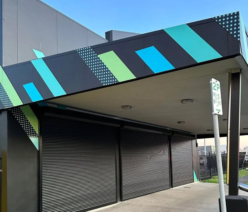 Roller shutters closed under an awning